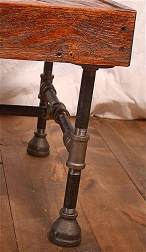 repurposed pallet and iron pipe coffee table
