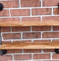 repurposed pallet and iron pipe wall hanging shelf