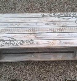 upcycled wooden pallet coffee table with artistic scrolls