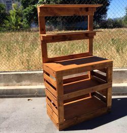 light brown stained pallet potting bench